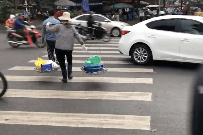woman in hanoi traffic